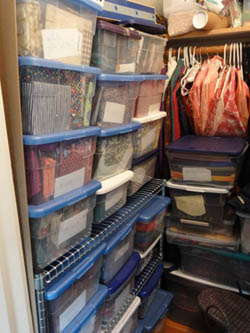 photo of closet with bins of fabric