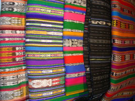 stack of woven Guatemalan fabrics